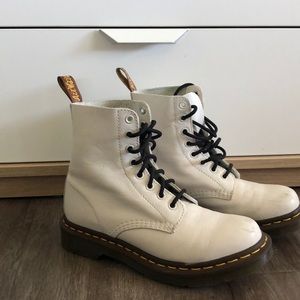 White Dc Martens with black laces.